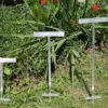 Three aluminum sign post holders of varying sizes, ideal for mounting PVC or wood signs securely in outdoor spaces.